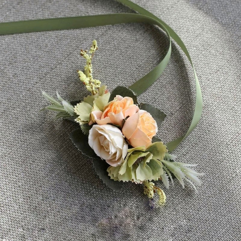 Beautiful wrist corsage made with artificial silk roses