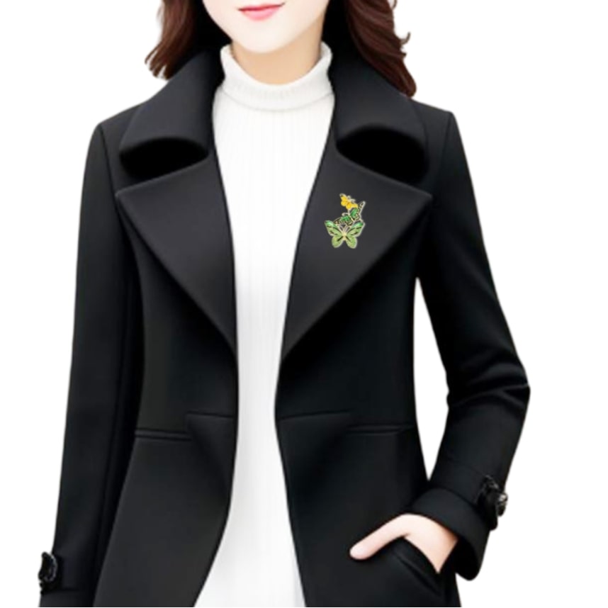 woman in black coat with green flower on lapel, wearing pretty enamel butterflies brooch with two green butterflies and one golden butterfly