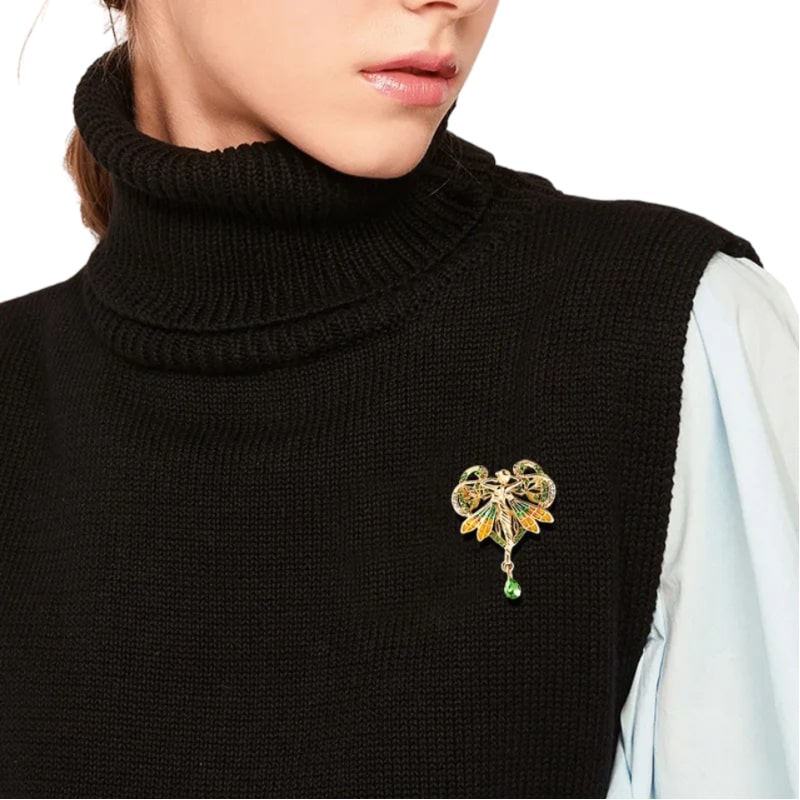 A unique Lady Butterfly Wings Brooch in golden, green, and orange. Adds elegance and sophistication to any outfit.