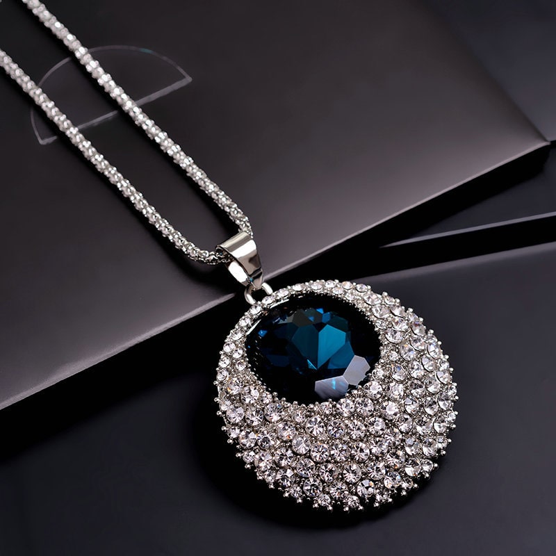Ocean Blue Crystal Pendant with Diamond shaped stone Center on Long Silver Chain