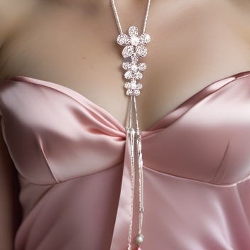Elegant Long Chain Flowers Necklace with stacked flowers adorned with rhinestones and pearls