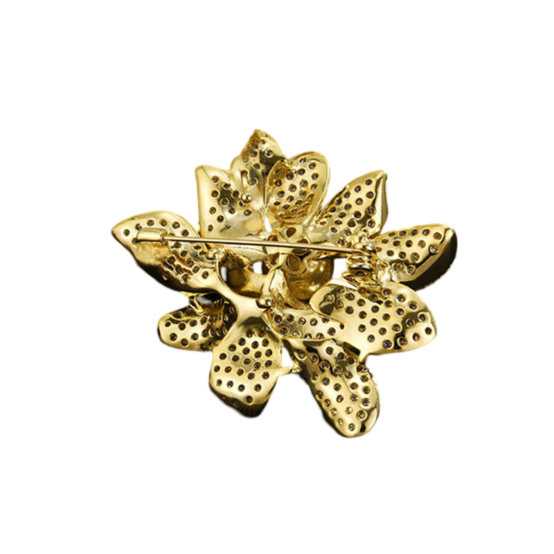 shiny golden brooch with leaf design