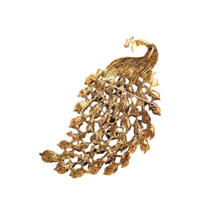 gold coloured with rhinestones, this brooch showcases detailed craftsmanship and timeless beauty