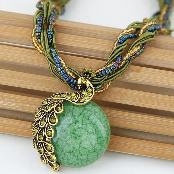 stand out with our Vintage Beads Peacock Necklace, showcasing a green and gold pendant