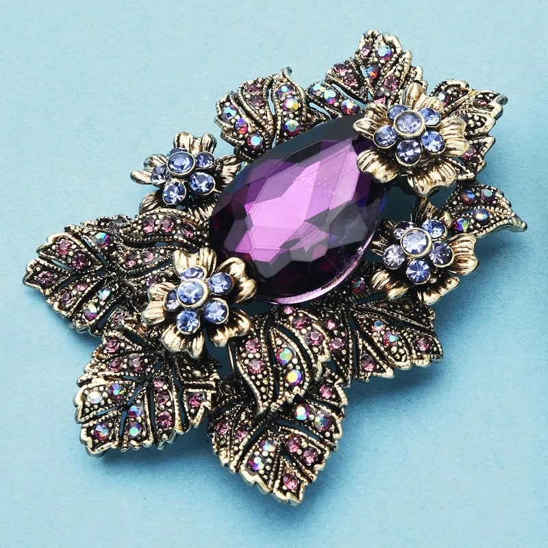 Stunning Purple Palace Style Flower Brooch with rhinestones, golden leaves, and purple stone
