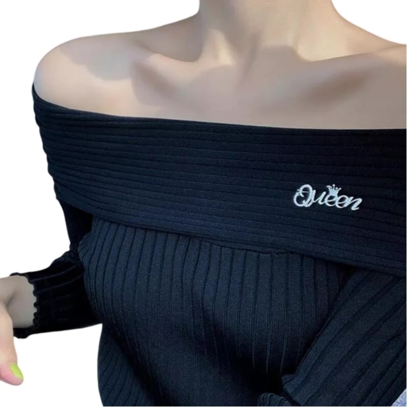 Black-coated woman flaunts silver rhinestone queen brooch