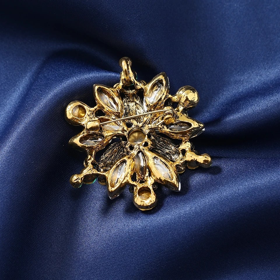 Opulent luxury crystal snowflake brooch with a flower motif