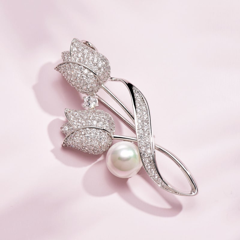 sophisticated silver tulip brooch featuring white pearl and stones