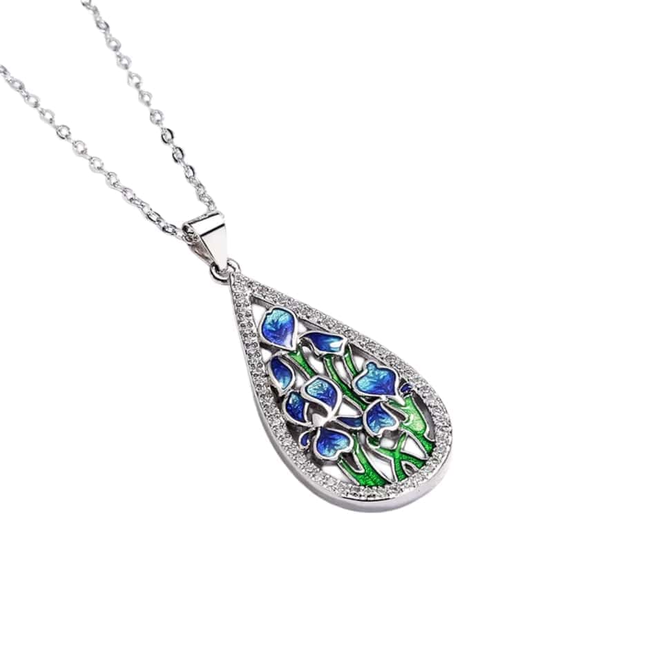 stand out with our Handmade Enamel Zirconia Silver Necklace featuring a tear-shaped pendant with diamond and emerald