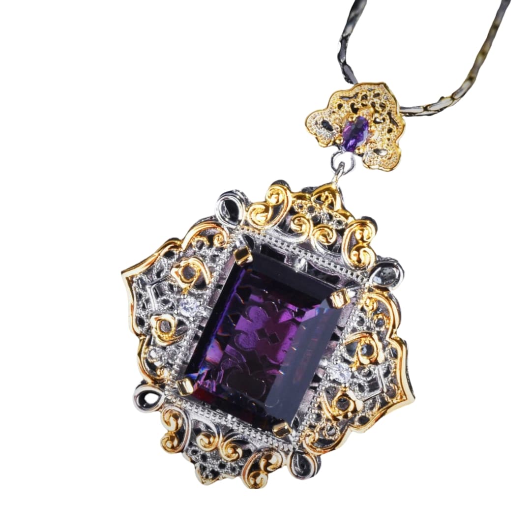 with its purple stone set in a gold and silver pendant, this Italian-carved amethyst necklace adds glitz and refinement to any ensemble.