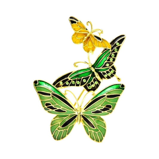 exquisite golden and green butterfly brooch with intricate detailing