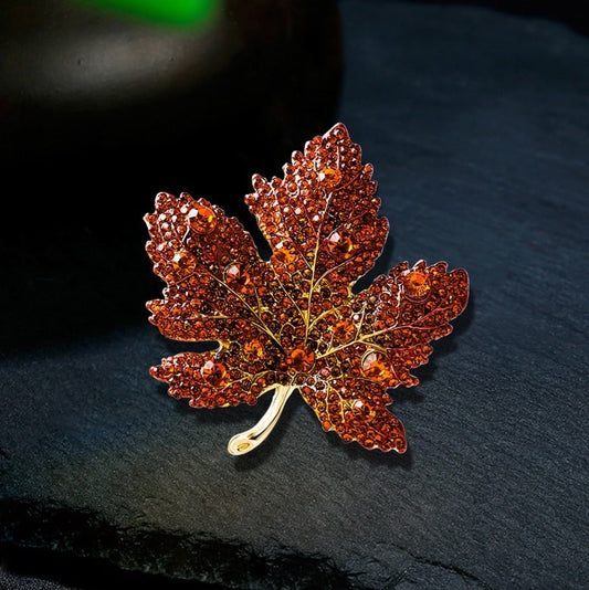 vibrant maple leaf brooch with red crystals, symbolizing love and loyalty, a heart-stopping accessory for women's collection