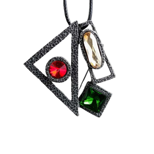 Vintage gothic pendant necklace with black and red design, featuring a green and red stone