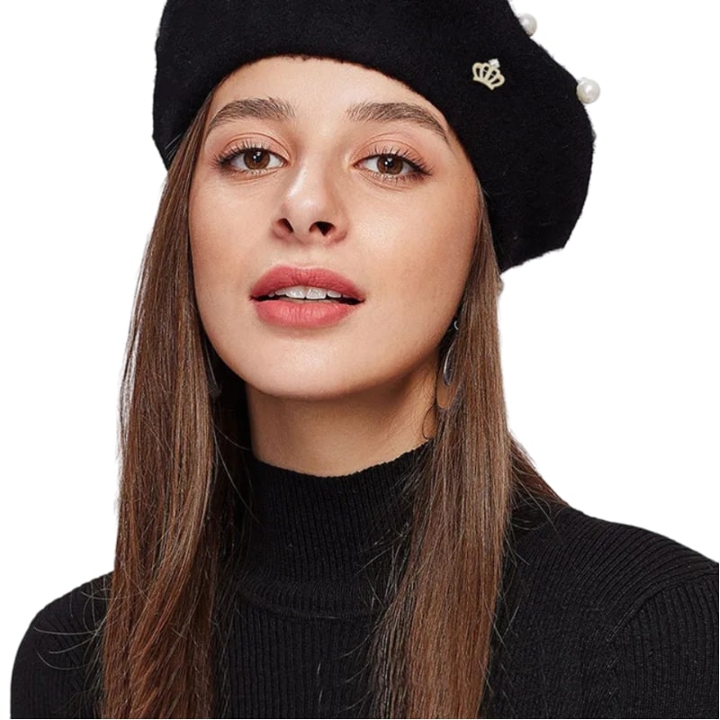 Woman in black beret with pearls, symbolizing elegance and sophistication get your own Zircon Queen Crown Brooch for a touch of royalty